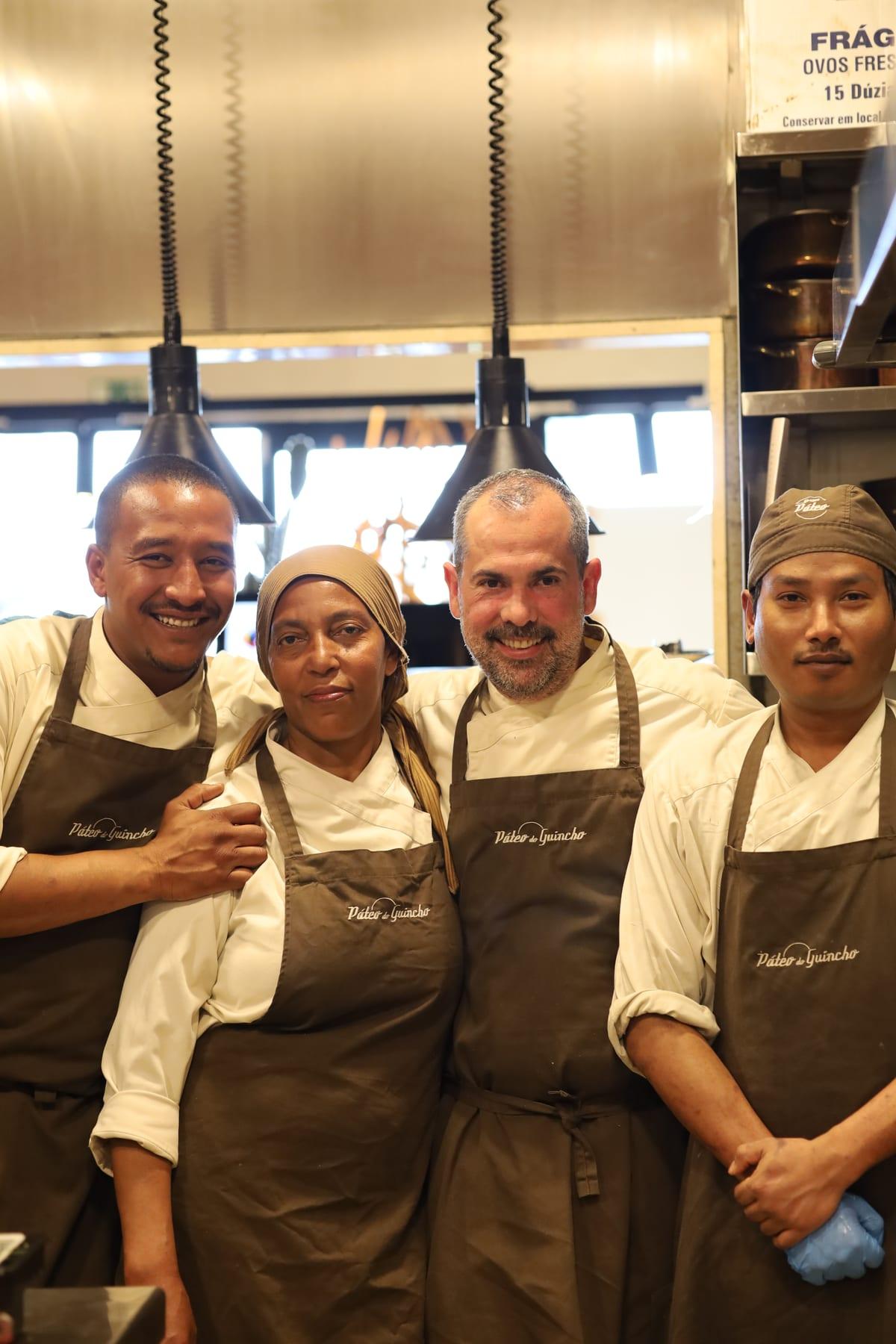 The Páteo do Guincho team smiling in the restaurant kitchen