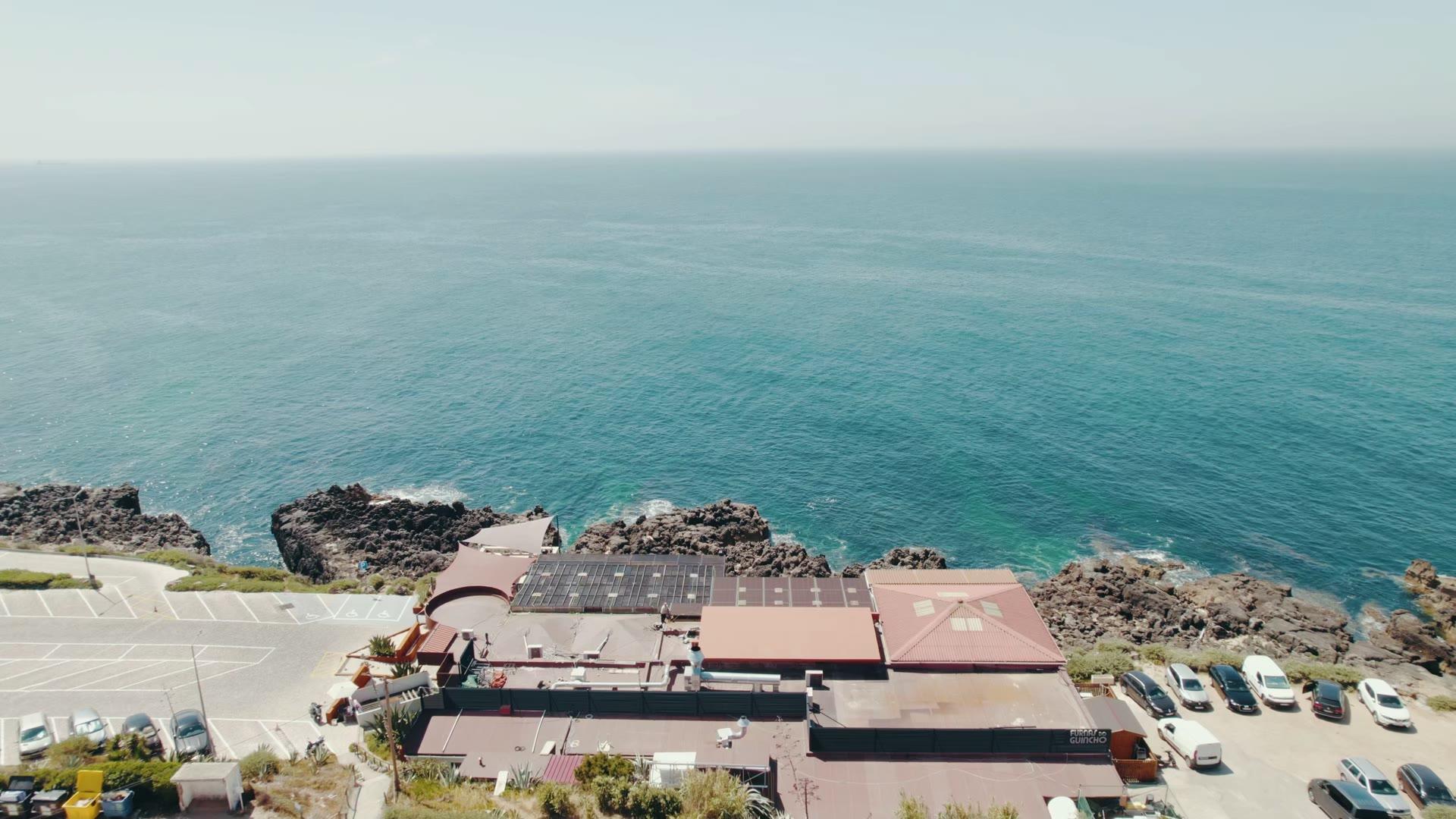 Aerial view of the Guincho coast with a restaurant on the cliff