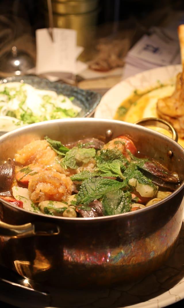 Seafood stew served in a copper pot
