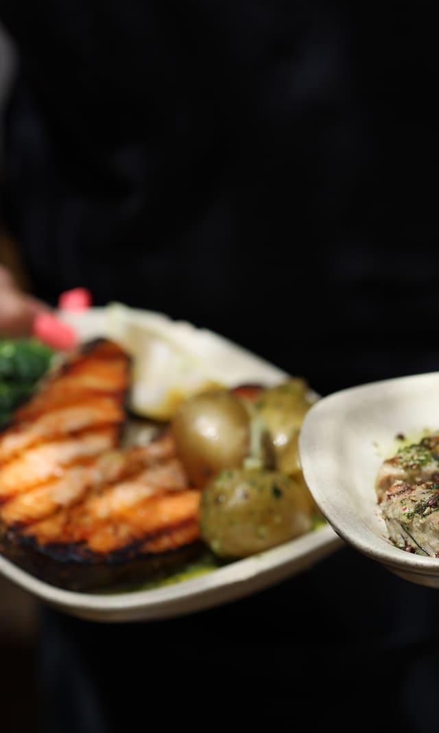 Plated fish dish with vegetables