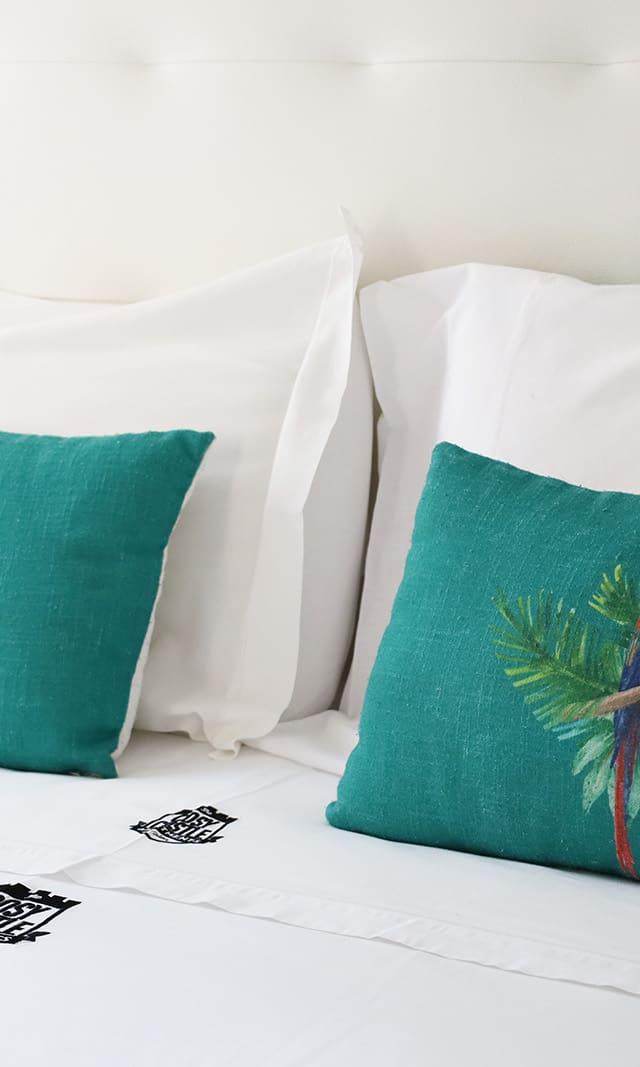 Cosy Castle bed with patterned green cushions